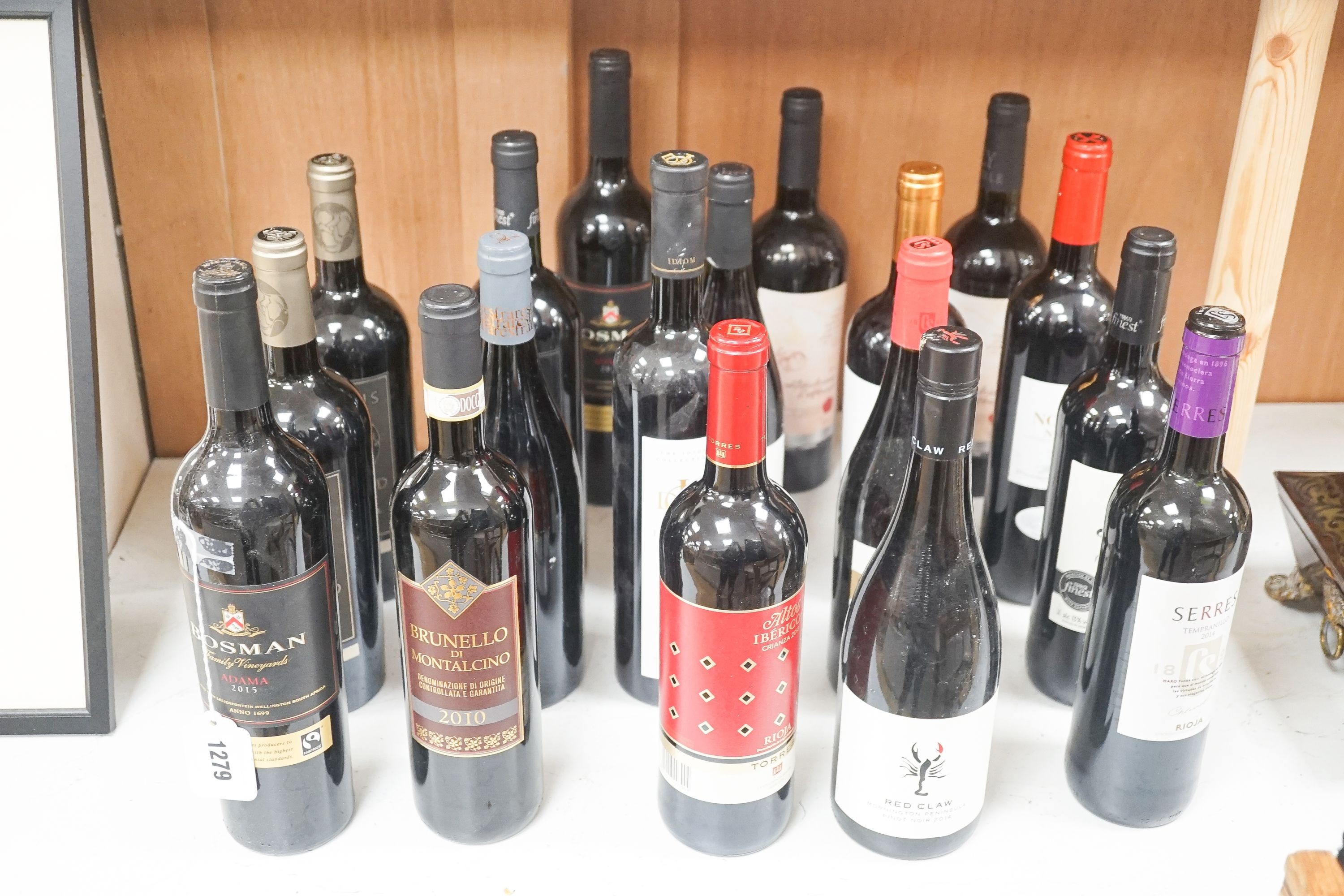 Eighteen assorted bottles of European, North & South American, South African and Australian red wines including Estacion 1883 2012 Pinot Noir, Bosman Adama 2015, Idiom Cape Blend 2008 and Ravens Wood Old Vine Zinfandel,